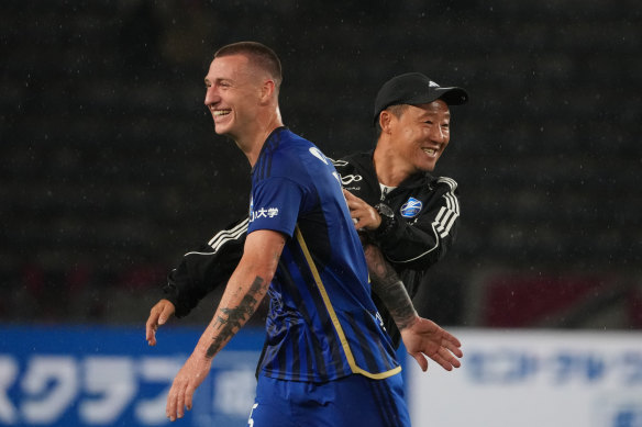 Mitchell Duke with Machida Zelvia coach Go Kuroda, who has the newly promoted side on top of the J1 League table with 11 rounds to go.