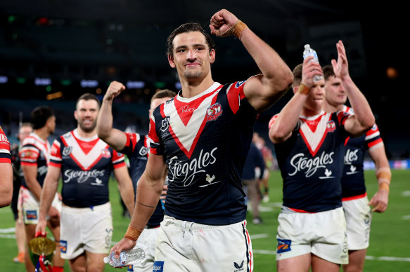 Billy Smith and the Roosters celebrate their victory.