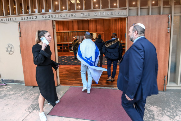 Members of the Jewish community in Melbourne arrive at a rally.