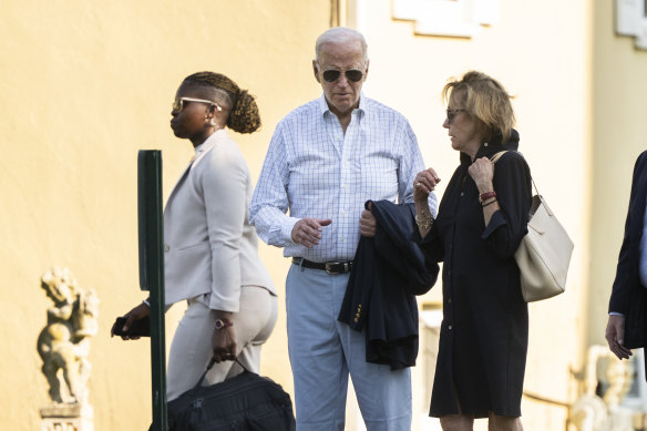 Biden walks with his sister Valerie Biden Owens (right), after attending a mass in Wilmington, Delaware, last year.