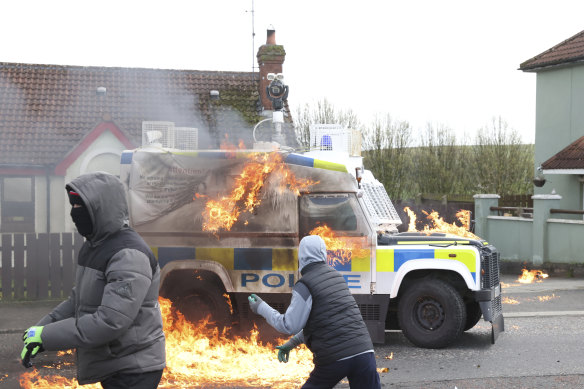 Masked youths threw petrol bombs at a police Land Rover in Londonderry on Monday.
