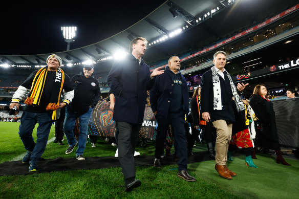 Andrew Dillon, AFL CEO Elect, AFL great Michael Long and Deputy Prime Minister Richard Marles are seen on the Long Walk during the 2023 AFL Round 10 match between the Essendon Bombers and the Richmond Tigers.