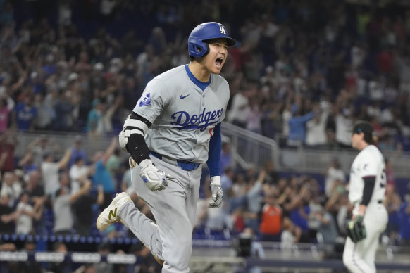 Shohei Ohtani celebrates hitting home run No.50 in 2024.