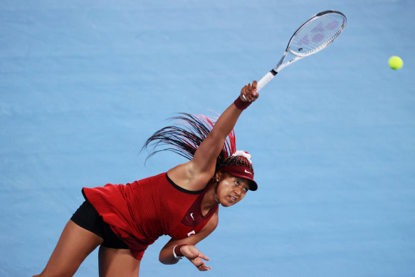 Naomi Osaka serves on day four of the Tokyo Olympics.