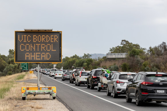 No end in sight: a queue of frustrated motorists stretches back into NSW from the border town of Albury on New Year's Day.