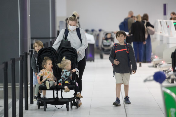 Eddie Betts' family, including wife Anna Scullie and their four children, at Melbourne airport on Thursday.