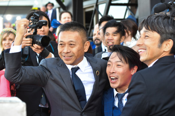 Hong Kong trainer Danny Shum raises a fist to celebrate Romantic Warrior’s Cox Plate win. 