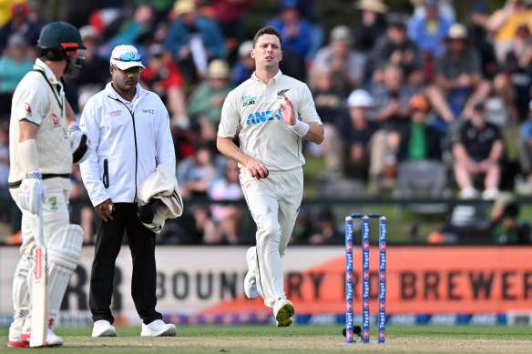 Matt Henry runs in for New Zealand. 