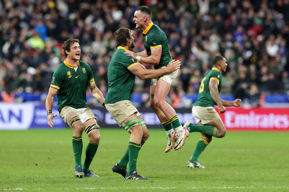 Jesse Kriel of South Africa celebrates with Eben Etzebeth the team’s victory in the Rugby World Cup Final against New Zealand in Paris.