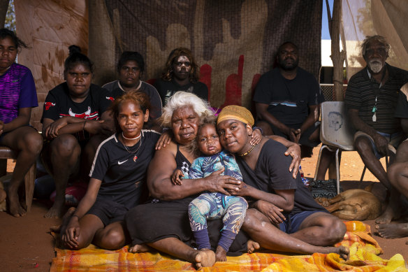 Lottie Robertson (middle) with Rakeisha Robertson (right) and family at Women’s sorry camp shortly after Mr Walker’s death.
