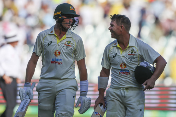 Marnus Labuschagne and David Warner leave the field at stumps.