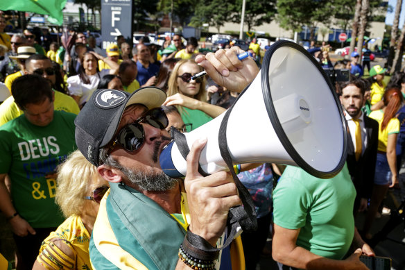 Bolsonaro supporters shout slogans outside the Liberal Party’s headquarters in Brasilia.