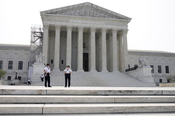 Officers stand guard outside the Supreme Court.