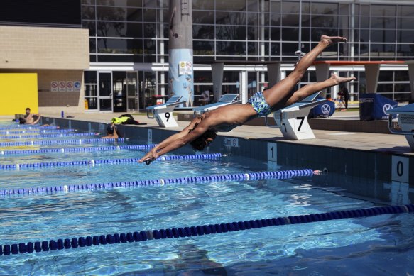 Deen Amin and his younger brother Malik swim at Auburn Ruth Everuss Aquatic Centre. From Monday, the facility’s usually busy indoors pool will reopen for swimming lessons and other training and rehabilation. 