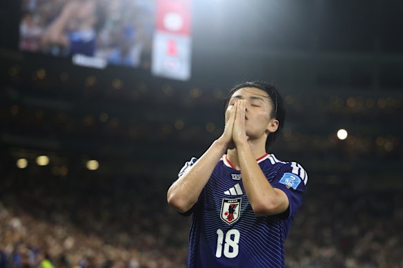 Ueda celebrates his goal, giving Japan a 2-0 lead. 