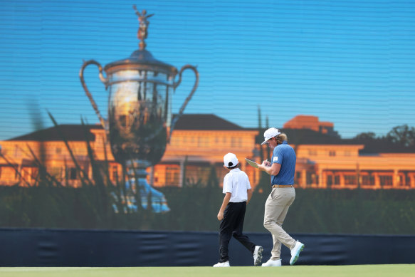 Smith signs an autograph for a young fan in the lead-up to the year’s penultimate major.