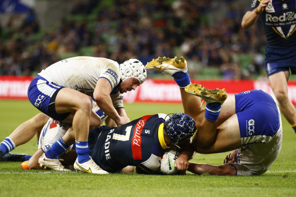 Jahrome Hughes goes over for a Storm try in the loss to the Bulldogs.