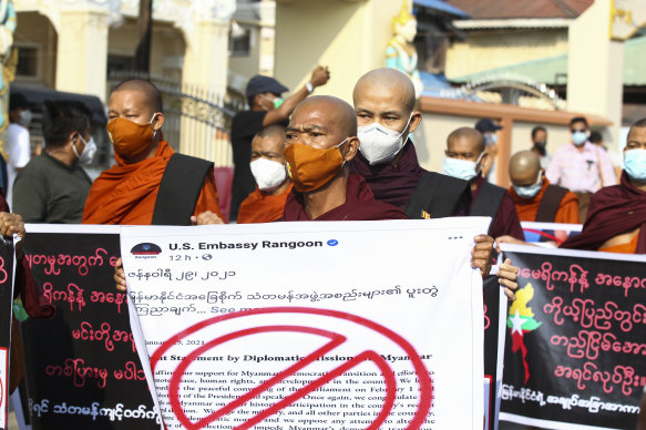 Buddhist monks participate in a protest against the election results with supporters of the Myanmar military and the military-backed Union Solidarity and Development Party near Shwedagon pagoda on Saturday.