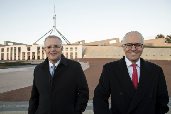 Then-treasurer Scott Morrison and then-prime minister Malcolm Turnbull after the 2018 budget which included a planned three stage tax plan. The benefits of the plan have been eaten by bracket creep for middle-income earners.