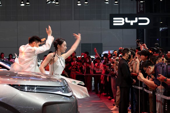 Dancers entertain visitors at the BYD booth.