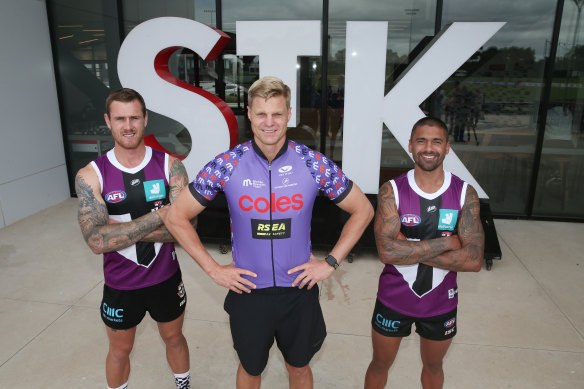 Nick Riewoldt was back at St Kilda on Tuesday, with Tim Membrey (left) and Brad Hill (right) to promote fundrasing for Maddie's Match.