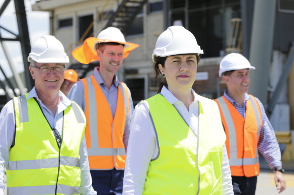 Les Walker (left) seen with Transport Minister Mark Bailey and Premier Annastacia Palaszczuk during the 2020 election campaign.