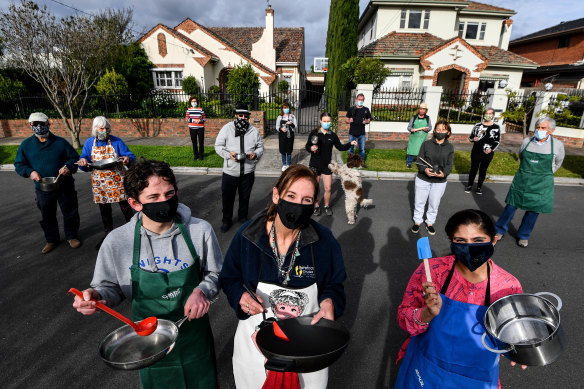 Neighbours on Chloris Crescent in Caulfield cook together via Zoom and take turns to teach. (Front left to right) James and his mum Jennifer Hunt and Bindya Bedi.