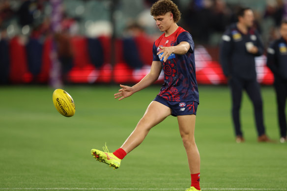 Koltyn Tholstrup warms up before his Melbourne debut at the MCG.
