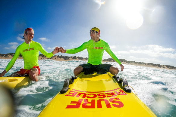 Lifeguards Conor Morone and Jack Liszukiewicz take a breather between waves at Gunnamatta. 