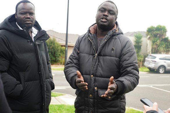 “I need answers for my son.” Elbino Akueng (right), whose 15-year-old son, Dau, was stabbed to death in Cobblebank, calls for justice.