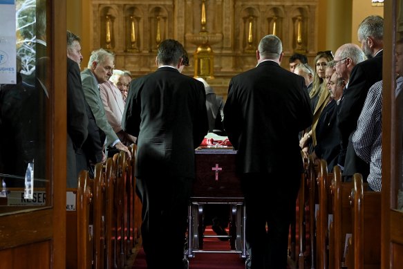 The coffin of David Morrow is taken into St Brigid’s Catholic Church in Coogee.