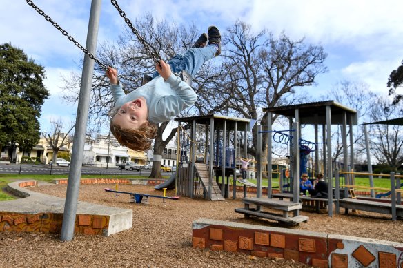 Louis Cummings, 8, enjoys one last swing at Curtain Square park in Carlton on Monday.