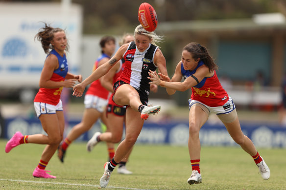 Tarni White gets a kick away for the Saints.