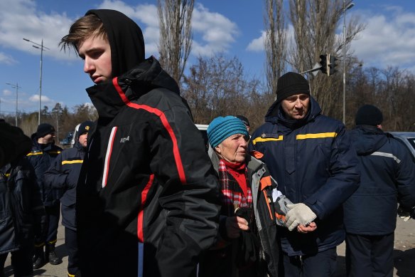 Hennadiy, 17, lost his  mother in an airstrike.  He is with his                 
great-grandmother Halyna Lohina.