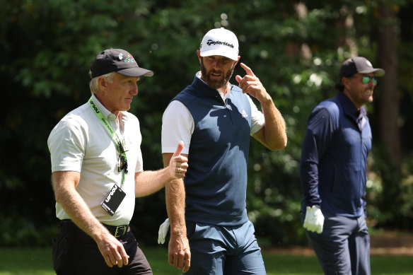 LIV Golf CEO Greg Norman with players Dustin Johnson and Phil Mickelson at a tournament held in England this month.