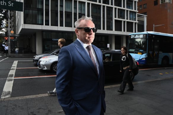 NRL journalist Paul Kent walks into Downing Centre Local Court on Wednesday to fight domestic violence charges after he allegedly attacked a 33-year-old woman.