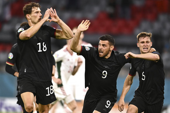 Leon Goretzka, left, celebrates the goal that kept Germany in Euro 2020.