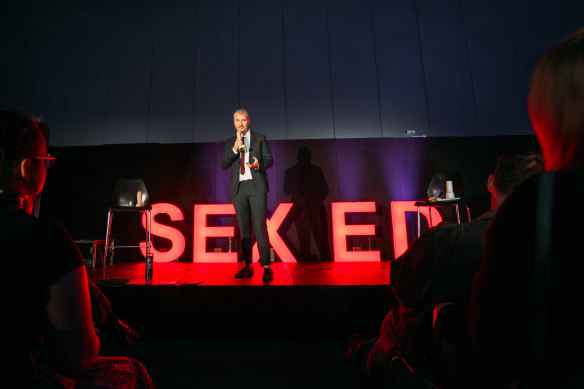 Sex educator Luke Skewes on stage at LoveX.