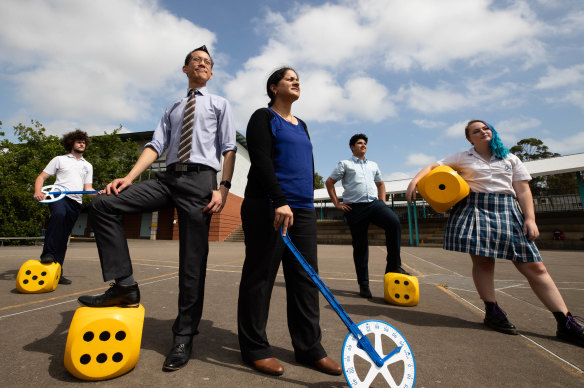 Eddie Woo with teacher, Kuldip Khehra at Quakers Hill High School with students, Liam Sammons, Anirav Punj, and Chelsea Ayscough.