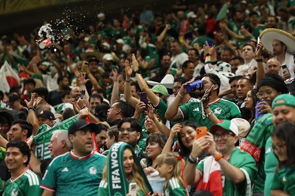 Mexican fans celebrate their 1-0 victory.