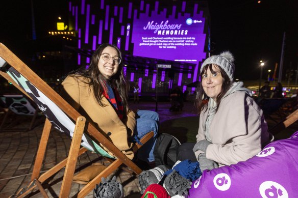 Neighbours fans Liana Tieri (left) and Caroline Kilkenny at Federation Square watching the final episode of Neighbours.