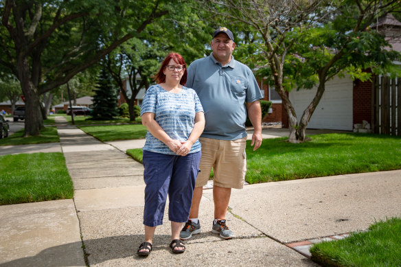 "Elections in our country have become a do-or-die team sport": Peggy and Frank DiMercurio outside their home in Macomb County, Michigan.