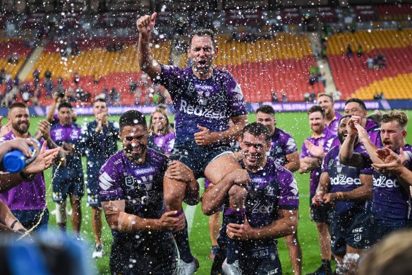 Mebourne Storm captain Cameron Smith is chaired off by teammates after the preliminary final win against the Raiders in 2020.