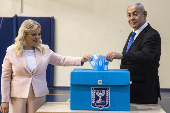 Israeli Prime Minister Benjamin Netanyahu and his wife Sarah cast their votes in Jerusalem.