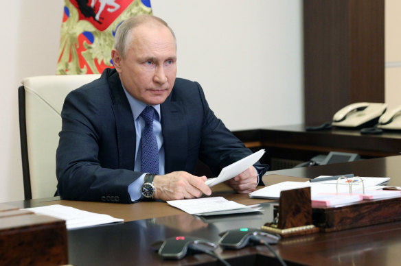 Russian President Vladimir Putin chairs a conference call, during which he threatened to “knock out the teeth” of opponents.