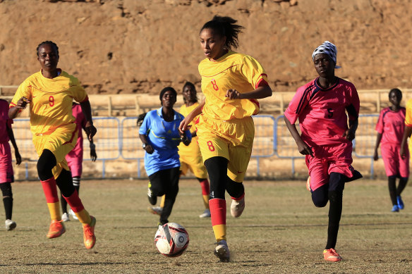 Sudanese al-Difaa, in pink, and al-Sumood women's teams play in Omdurman, Khartoum's twin city, Sudan. 