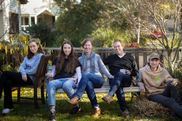 Melissa and James Thyer (centre) with their children, Ella, Alexandra and Ted.