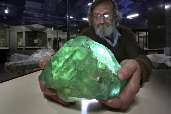 Ross Pogson, from the Australian Museum, holds its Fluorite crystal sample, which is sometimes mistaken for Kryptonite.