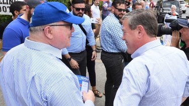 Tim Nicholls and George Brandis campaigning in Ascot on election day.