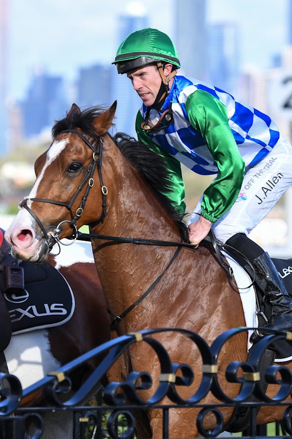 John Allen returns to the mounting yard aboard Grand Promenade after their win.